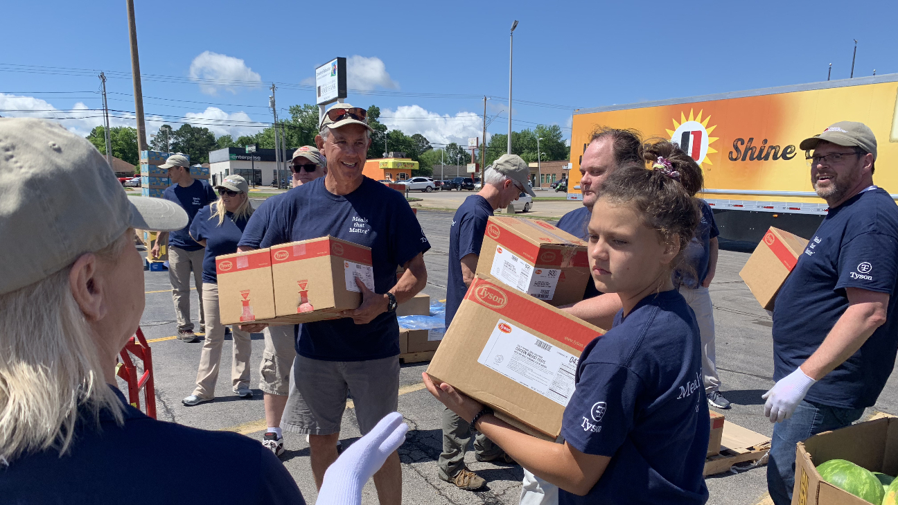 A photo of volunteers assisting with donation efforts.